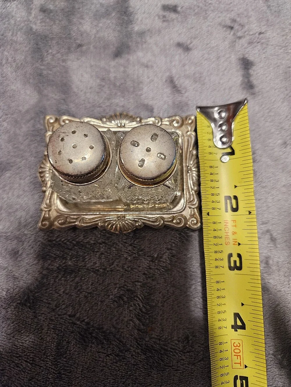 Vintage mini crystal glass salt and pepper shakers with a diamond pattern.